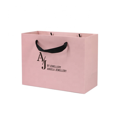 A laminação lustrosa calça sacos de papel que da roupa 250gam revestiu sacos cor-de-rosa de Kraft