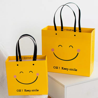 Do quadrado amarelo resistente dos sacos de papel de Kraft da cara do sorriso de choque do ISO saco de papel inferior